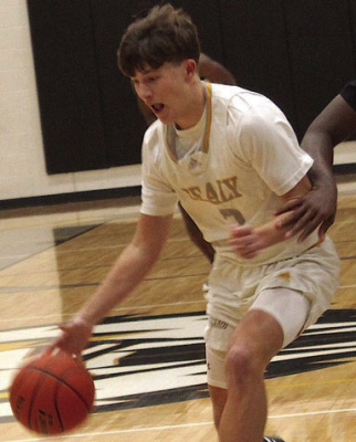 Sealy’s Brady Cranfill drives for a basket against HSI during last week's action.