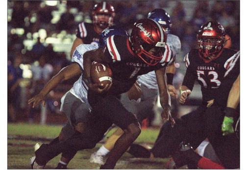 Brazos quarterback Jarvis Dickerson looks for running room against Rice Consolidated during last Friday’s district home opener. Brazos prevailed over Rice 14-7 to move to 1-1 in district play. PHOTO BY ABENEZER YONAS