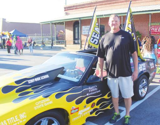 Sealy High School Automotive Technology Teacher Kenneth Simms stood proudly next to the completed Sealy Spirit Car made with parts from two Chevrolet Camaros. HANS LAMMEMAN