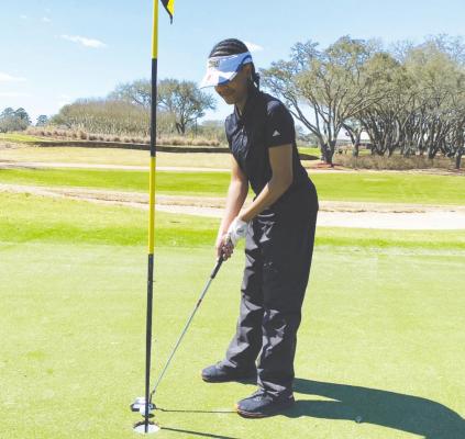 Sealy freshman Kaylie Dabney participated in her first varsity golf tournament last week at the Sand Hill Farm Golf Course and helped the Lady Tigers compete against golfers from Bellville, Brenham, Caldwell, Columbus and Magnolia. CONTRIBUTED PHOTOS