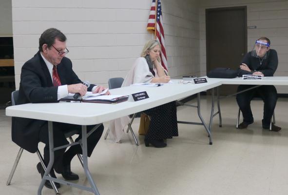 Former Sealy City Manager Lloyd Merrell, left, reads a statement during a special meeting of the city council Nov. 30, 2020, in which he asked them to let him do his job or else terminate his employment. Pictured next to him are council members Dee Anne Lerma and Chris Noack. (File Photo)