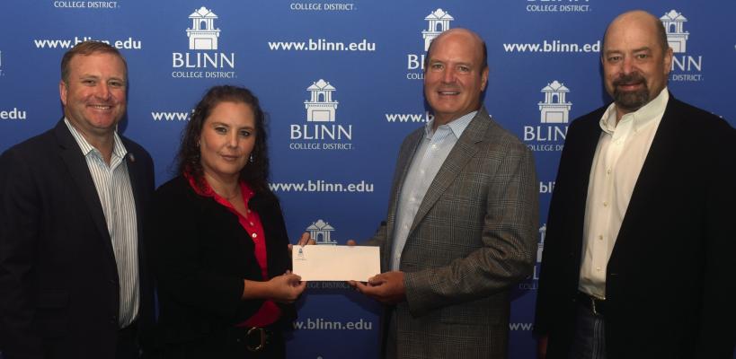 Coca-Cola Southwest Beverage (CCSWB) has made a $100,000 gift to the Blinn College Foundation to help first-generation students. Pictured are (from left) Wesley Miller, Area Director for CCSWB; Lana Fredrick, Sales Development Manager; Michael Schaefer, Chairman-elect of the Foundation Board of Directors; and Jimmy Byrd, Blinn-Bryan Campus Executive Director.