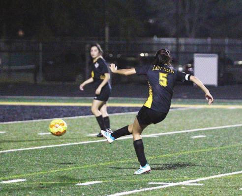 Sealy senior Coral Becerra puts a shot on net during the Lady Tigers’ district game against Discovery Feb. 26 at T.J. Mills Stadium. COLE McNANNA