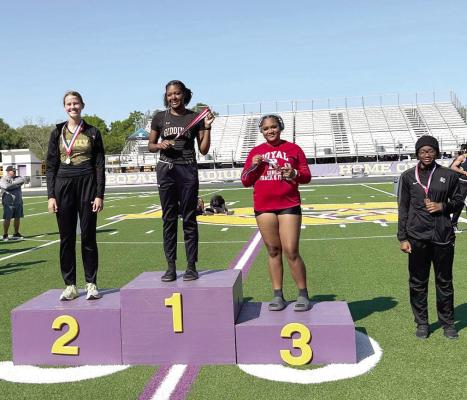 Brooke Baber (2nd place) and Mya Tumer (4th place) at the podium after the discus event. COURTESY PHOTO