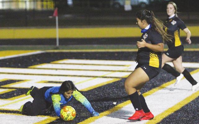 Sealy junior goalkeeper makes a diving stop in the Lady Tigers’ season-opening contest against the Giddings Buffaloes on Mark A. Chapman Field at T.J. Mills Stadium in Sealy on Jan. 5. Cole McNanna