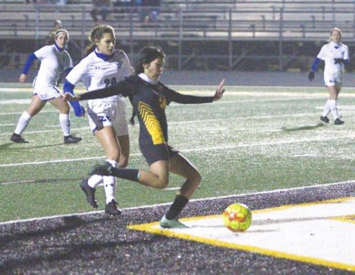 Sealy freshman Rebeca Garza lifts a shot past the Needville goalkeeper to give the Lady Tigers a 2-0 lead with less than 20 minutes to play in Monday’s non-district game at T.J. Mills Stadium.