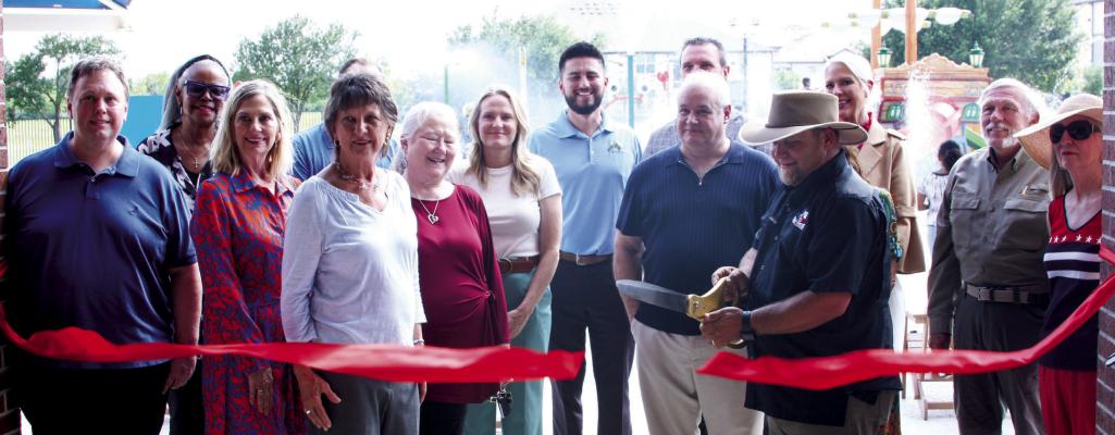 Above: Sealy city council members remarked the grand opening of the brand new splashpad with a ribbon cutting.