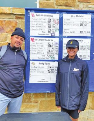 Sealy sophomore Kaylie Dabney and Coach Ray Dabney pose with the scorecard that sent the golfer to the Region III Championship as an individual qualifier after the district tournament in Navasota.