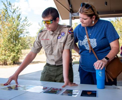 Boy Scout Carter Hughes discusses historical events with his mother Jennifer Hughes while doing an activity for his archeology merit badge, Saturday, Oct. 4, at the San Felipe de Austin State Historic Site.