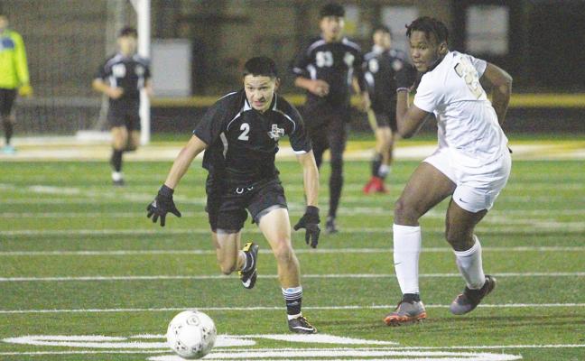 Sealy senior Ricky Avila (2) races after the ball in the Tigers’ final scrimmage of the preseason against the Foster Falcons Monday night at T.J. Mills Stadium. Avila returns to lead the team with the season set to start on Jan. 8. Cole McNanna