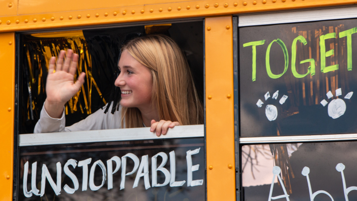 Abby Kovar waves to family and community supporters at the cross country team's sendoff to regionals, Monday, Oct. 20, at Sealy High School.