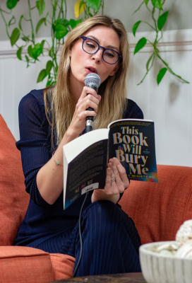 1.	Author Ashley Winstead reads the beginning of her most recent novel "This Book Will Bury Me" during an author event, Thursday, Nov. 20, at The Story Peddler bookstore.