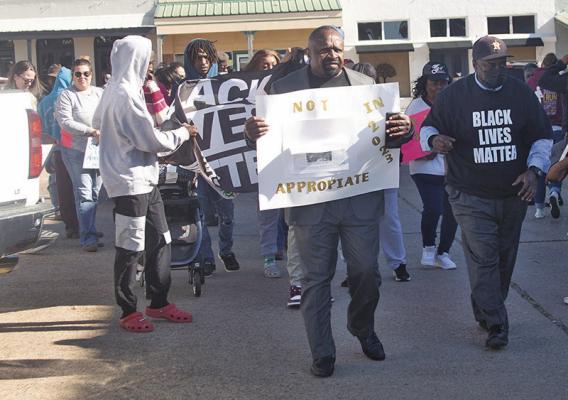 Area residents gathered at the Austin County courthouse to march to the Austin County Jail in a silent protest at the handling of the Lindemann Store incident. PHOTOS BY JIMMY GALVAN