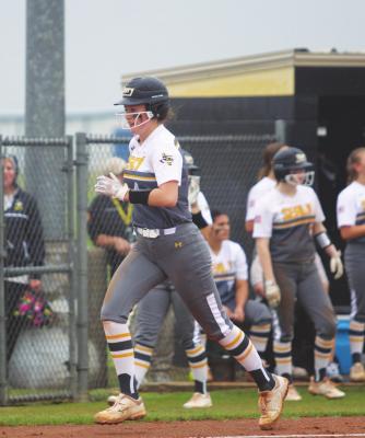 Sealy senior Avery Oliver runs down the third-base line to score a run for the Lady Tigers in the bi-district round of the playoffs April 29 at Sealy High School Softball Stadium. COLE McNANNA