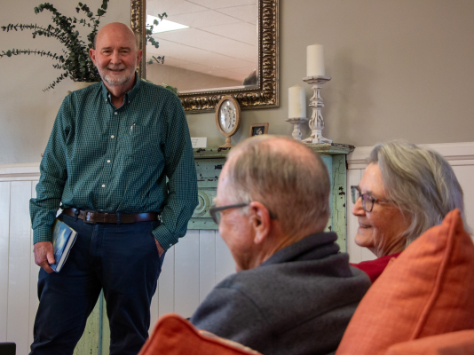 Ken and Diane Kramer (front), of Chappell Hill, laugh to a joke by essayist Steve Harrigan (left) during an author event, Thursday, March 19, at The Story Peddler bookstore in Bellville. ALL PHOTOS BY THE SEALY NEWS | ALLISON DRINNON