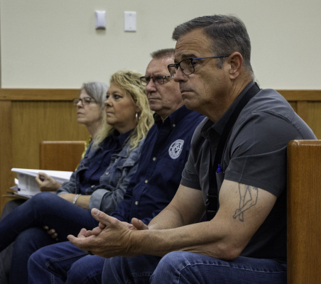 Donald Darracq, Bryan Haevishchan, Kim Spacek and Liz Cubz watch public comments about data centers during Austin County Commissioners Court, Monday, June 8, in Bellville. PHOTOS BY THE SEALY NEWS | ALLISON DRINNON
