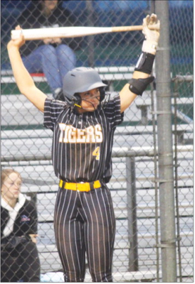 Left: Avery Grigar stretches her shoulders before stepping into the batter’s box for the Lady Tigers. SEALY NEWS | EVAN HALE