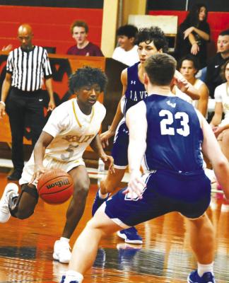 Sealy’s Mo Wigfall brings the ball upcourt againts LaVernia during the Schulenburg tournament.