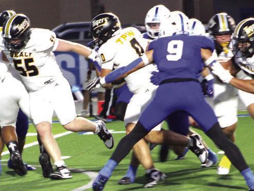 Sealy had to fight hard for their yardage in Friday night’s game against Needville. Here Romeo Castillo, 0, fights for yardage behind the blocking of Case Lyons, 55, and Rylan Ponce, 58, and a pair of unidentified Tiger blockers. Castillo was held to 50 rushing yards but added a 33-yard touchdown reception.