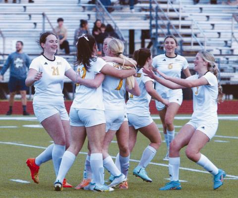 The Lady Tigers celebrate scoring a goal as a team. PHOTOS BY ABENEZER YONAS