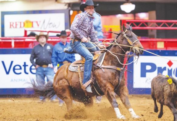 Bellville’s Caleb Smidt dismounts his horse Pockets during the tie-down roping event at the American Rodeo Semi-Finals in Fort Worth earlier this year. In December, Smidt and his horse Pockets claimed their third tie-down roping world title at the National Finals Rodeo in Las Vegas, NV. JACK LINK, THE AMERICAN RODEO/RURAL MEDIA GROUP