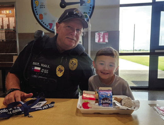 Jack Williamson is a second grader at Sealy Elementary and he recently won lunch with an officer for good behavior. Williamson was joined by Sealy Police Sgt. Terry Hall. COURTESY PHOTO