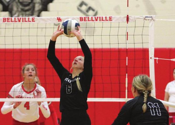 Sealy senior Breanna Brandes sets a ball during the Lady Tigers’ district match against Bellville on the road last Friday. Brandes – who was named the district’s setter of the year her first three years in a row – returned from injury earlier in the week for her first action of the season. COLE McNANNA