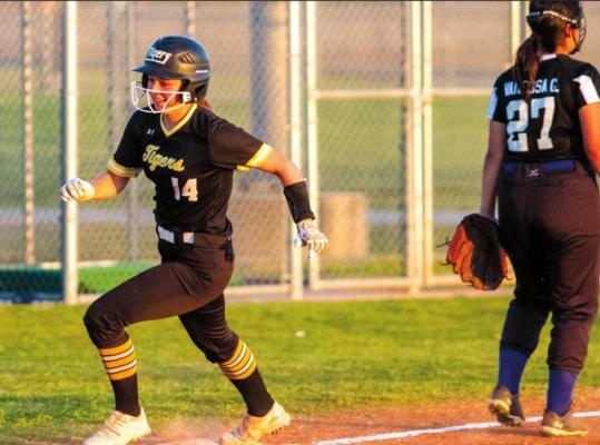 Lady Tiger sophomore Blair Kram rounds third and eyes the plate in the second inning of Sealy’s District 24-4A contest in Brookshire against the Royal Lady Falcons last Friday. COLE MCNANNA