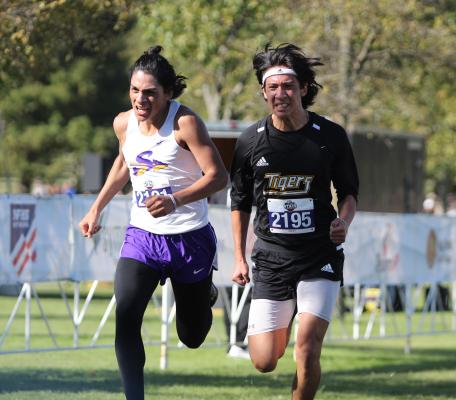 Sealy senior Daniel Medrano battles Sanger’s Jose Rojas at the finish line of the Class 4A State Championship meet at Old Settlers Park in Round Rock Nov. 6. COLE McNANNA