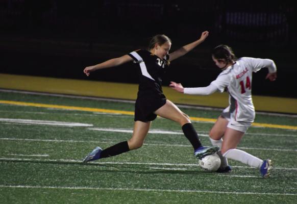 Freshman defender Maddie Withrow stops senior Ciana Avila in her move to the goal. COURTESY PHOTO