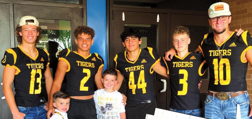 ABOVE: Sealy High School student-athletes were among those welcoming students back to Maggie B. Selman Elementary on the first day of school Aug. 18. Lawson and Landon Leed got the opportunity to meet Tiger football players Gage Grigar, D’vonne Hmielewski, Joel Chavez, Max Wickens and Thomas Clark on their first day of school in Sealy.RIGHT: Israel, Edgar (freshmen) and Michaela (Pre-K) Santos. BELOW RIGHT: Bradley (4th grade) and Kasey (6th grade) Picard. COURTESY PHOTOS
