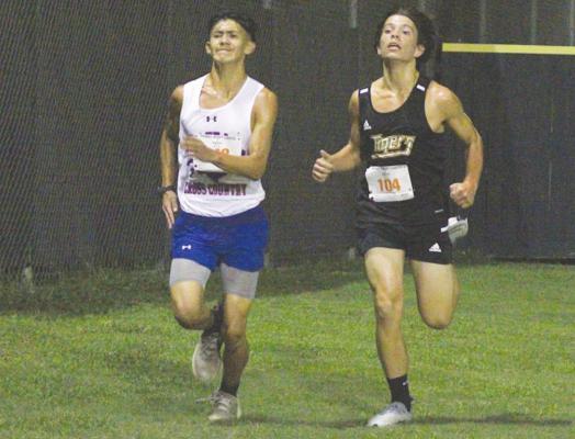 Sealy freshman Gavin Almaguer finishes the home stretch at the season-opening Frio Friday Night Lights meet at home, Aug. 20. Almaguer registered sixth overall in last weekend’s meet in Bellville to help the Tigers claim the team championship. COLE McNANNA