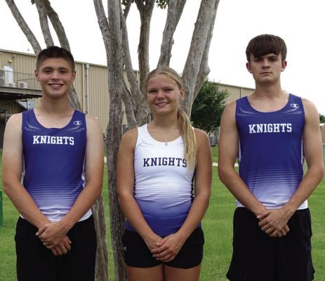 Quinton Moore (left), Daniela Skardenni and Ethan Stegent pose for a photo together after their race.