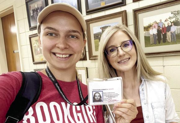 Linda Cevere is pictured with city of Sealy’s Jennifer Matura as she gained her permit to sell books in the city limits. COURTESY PHOTO