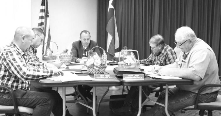 Austin County commissioners Chip Reed, Leroy Cerny, Judge Tim Lapham, Bobby Rinn and Mark Lamp met in close quarters to discuss the budget then returned to regular spacing for the rest of Monday’s regular meeting at the county courthouse. Hans Lammeman