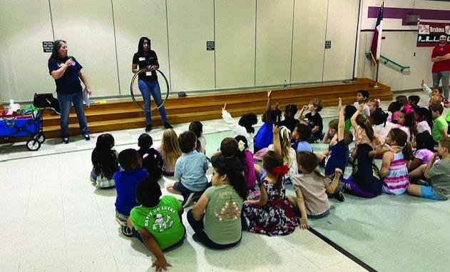 Pictured right to left: Tammy Wendel, FCS Advisory Board Member and Michelle Wright, Distinguished Agent – FCH with Texas A&amp;M AgriLife Extension Service teaching a class of students at Bellville ISD.