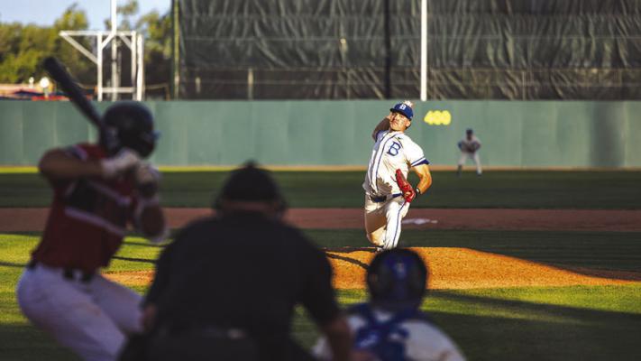 Blinn’s Brok Eddy fires a pitch home against Lake Land.