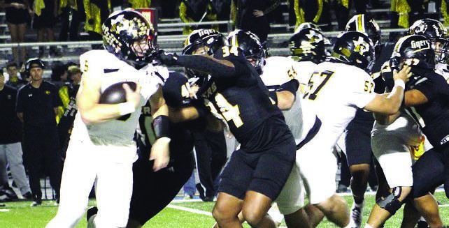 The Sealy Tigers defense breaks through the line to secure a tackle for loss against Gatesville in the bi-district round of the playoffs on Friday, Nov. 14, 2025, at Rockdale High School. PHOTOS BY HERBIE KOLLATSCHNY