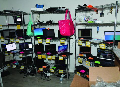 Christina Chapman organized and stored U.S. company laptops in her home, and included notes identifying the U.S. company and identity associated with each laptop.