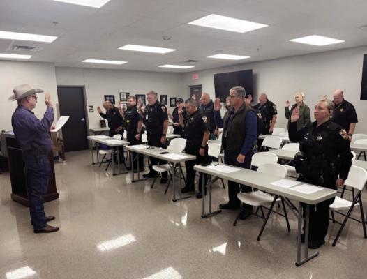 Austin County Sheriff Jack W. Brandes was sworn in for another four-year term on New Year's Day. All currently licensed peace officers at Austin County Sheriff’s Office were selected to continue their duties and responsibilities for the new term. Brandes began the process of swearing in deputies. COURTESY PHOTO