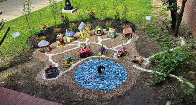 On Thursday, July 27, Boy Scout Rylan Crawley dedicated his Eagle Scout project to the Gordon Memorial Library in Sealy. According to AbbyLynn Moyle, manager of the library, the photo does not do the garden justice. “This young man has worked long and hard on this project. All of the houses were handmade. The little blue pebbles were handmade,” Moyle said. COURTESY PHOTO