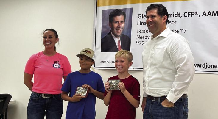 Hannah Muegge (match director), Jones Garza (1st place, junior division), Declan Wilborn (3rd place, junior division), Glenn Schmidt (match sponsor)