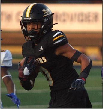 Sealy’s Noah Washington returns an interception down the field against Bay City. Washington had two interceptions during the contest. PHOTO BY ABENEZER YONAS