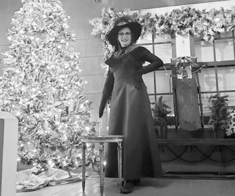 Angela Leschper on the porch of one of the houses featured in the Christmas tour of Old Sealy Sunday, Dec. 19. CONTRIBUTED PHOTOS