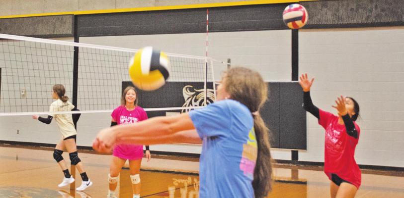 Sealy High School volleyball players participating in passing drills during the Sealy Volleyball Team Camp July 18 included Meredith Rapsilver (left), Blair Kram, Annabelle Williams and Krystal Bludau. The two-day camp was hosted by directors Kaitlyn Corbett, former Southwestern University player, and Madison Holle, former Cameron University player and Brazos Christian High School head coach. JASON MANAGO-GRAVES