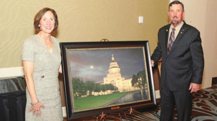 Senator Kolkhorst is presented the S.M. True Agricultural Champion Award from TFB President Russell Boening. CONTRIBUTED PHOTO