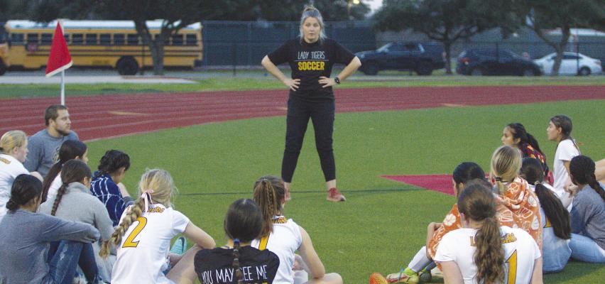 Sealy Head Girls Soccer Coach Danielle Eschenburg motivates the girls at halftime against Bellville. The Lady Tigers will be hoping to see the stands packed as they face the Navasota Rattlers at home this Friday, Feb. 9. PHOTOS BY ABENEZER YONAS