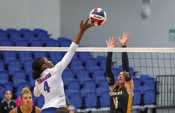: Sealy’s Avery Grigar goes up for a block during the Bay City tournament. Photo by Jimmy Galvan