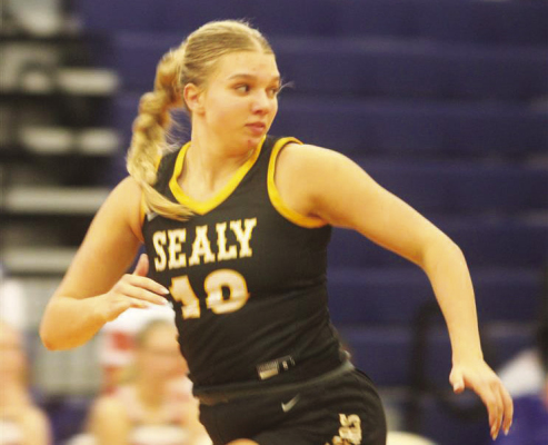 Baylee Brandes sprints down the court for a fastbreak opportunity.