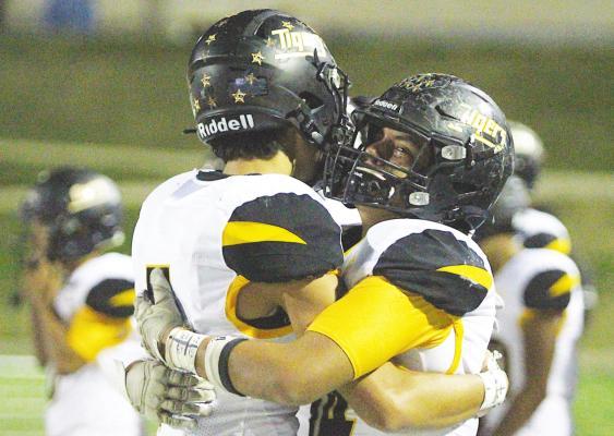 Sealy seniors Graham Samonte and Jonathan Monterroza embrace following the Tigers’ defeat to China Spring in the Area Championship at Waco ISD Stadium Friday night. COLE McNANNA